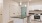 Apartment kitchen with white walls and green entryway door