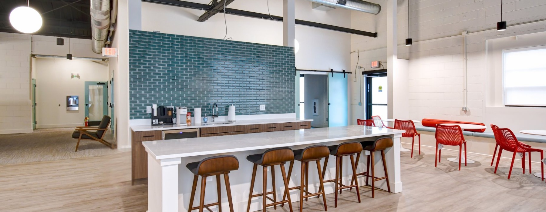 Clubhouse with kitchen that has blue backsplash